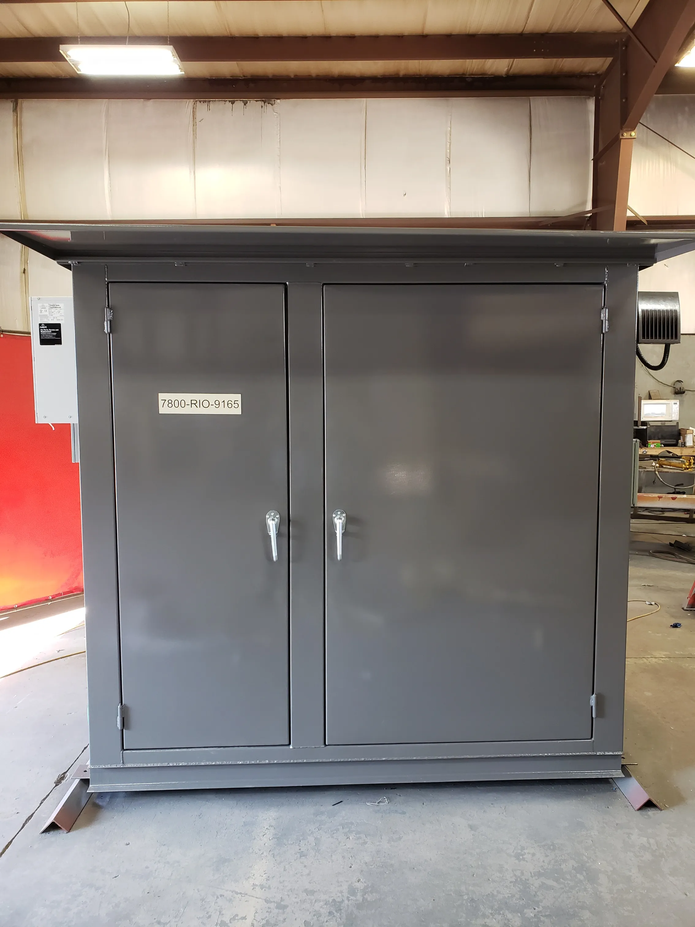 Custom drop-over enclosure protecting industrial equipment