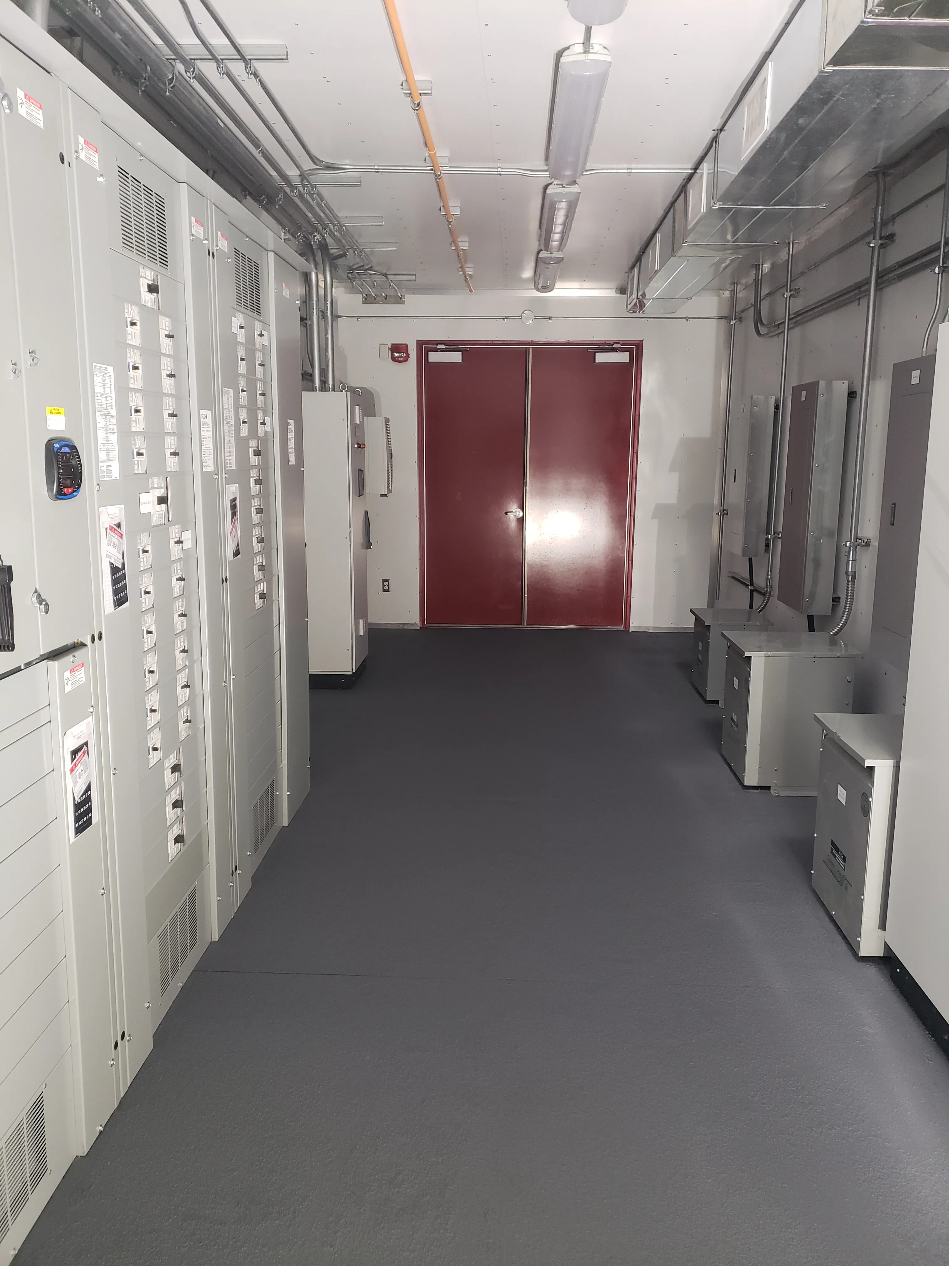 Interior of a completed NxStar electrical control room with switchgear cabinets and cable tray