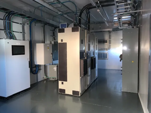 Interior of a completed NxStar electrical control room with switchgear cabinets and cable tray
